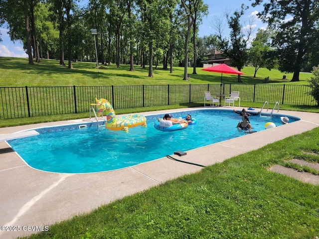 view of swimming pool featuring a fenced in pool, a fenced backyard, and a lawn