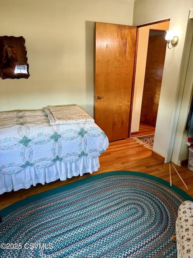 bedroom with wood finished floors