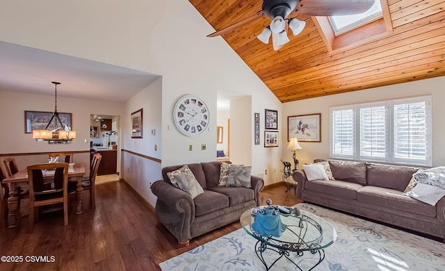 living room featuring a skylight, wood ceiling, wood finished floors, high vaulted ceiling, and ceiling fan with notable chandelier