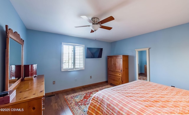 bedroom with visible vents, baseboards, ceiling fan, and wood finished floors