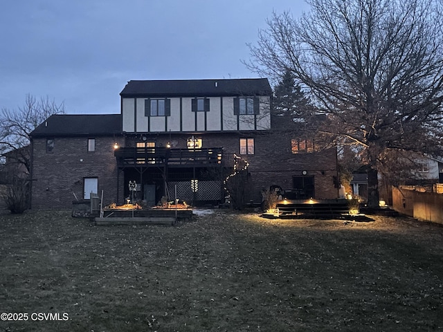 back of house featuring a wooden deck