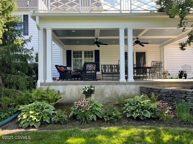 exterior space featuring a patio area and a ceiling fan