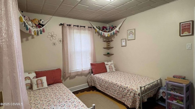 bedroom featuring baseboards