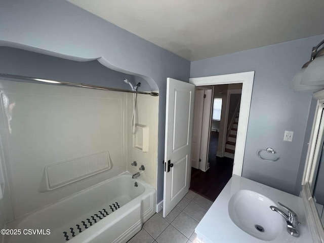 full bathroom featuring tile patterned flooring, a sink, and shower / bathing tub combination