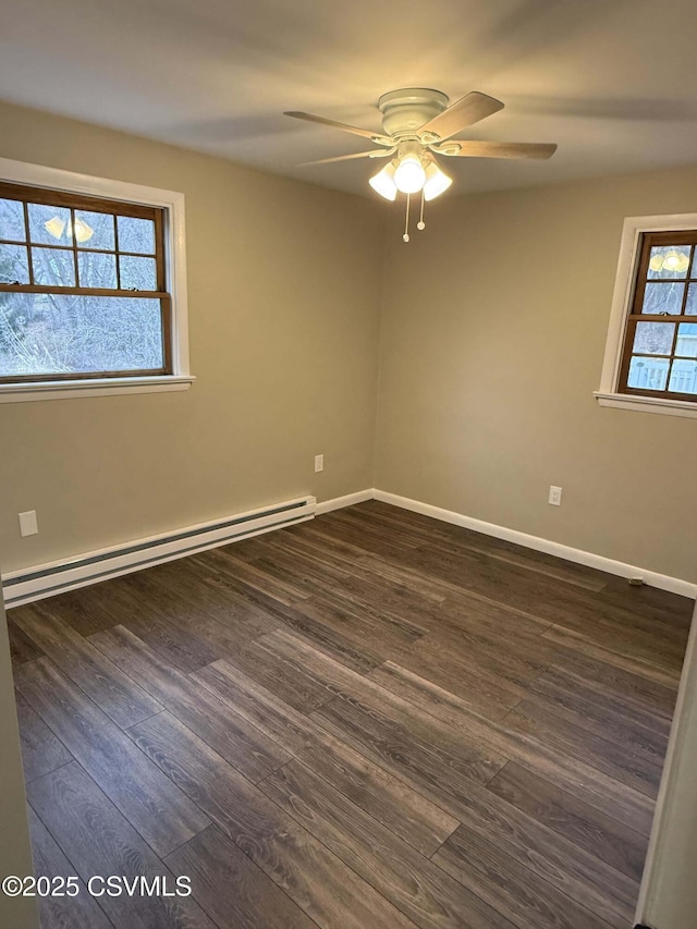 unfurnished room featuring a ceiling fan, baseboards, baseboard heating, and dark wood finished floors