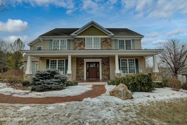 view of front of house featuring a porch and stone siding