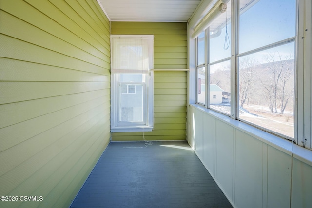 unfurnished sunroom with a mountain view