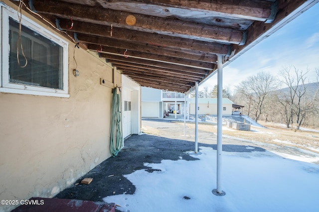 view of snow covered patio