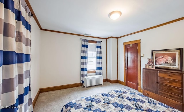 unfurnished bedroom featuring visible vents, baseboards, radiator heating unit, carpet, and crown molding