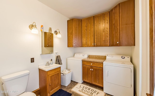 laundry area featuring laundry area, a sink, and independent washer and dryer