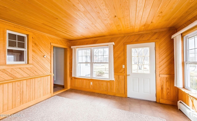 unfurnished sunroom with a healthy amount of sunlight, wooden ceiling, and baseboard heating