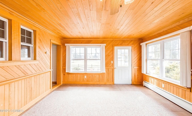 unfurnished sunroom featuring a baseboard radiator and wood ceiling