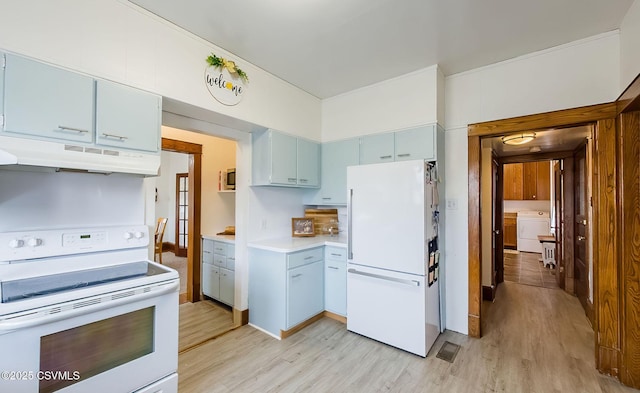 kitchen with white appliances, light wood finished floors, blue cabinets, light countertops, and under cabinet range hood