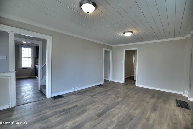 unfurnished room featuring visible vents, crown molding, and stairs