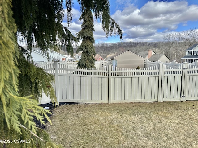 view of gate with fence