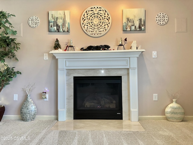 interior details with a fireplace and baseboards