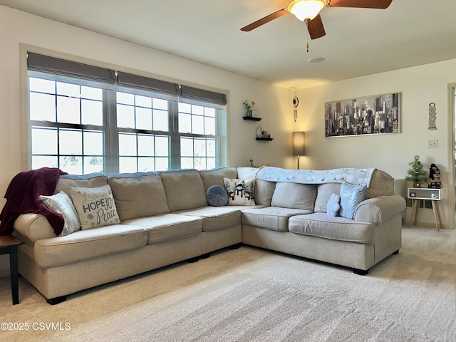 living room featuring ceiling fan and carpet flooring