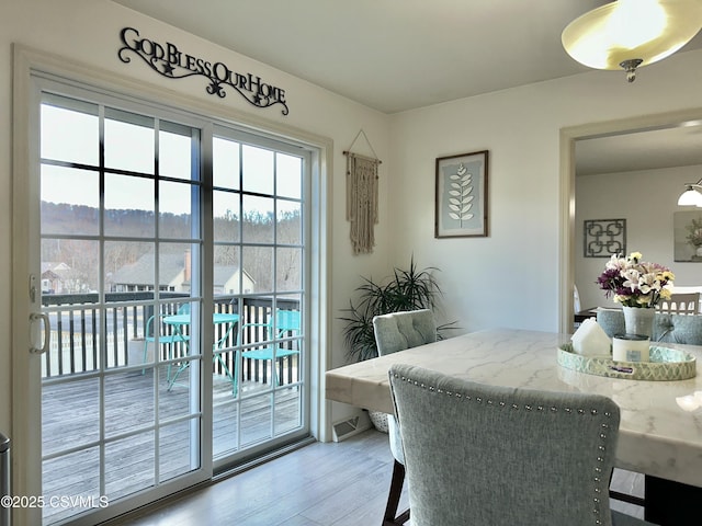 dining space featuring light wood-type flooring