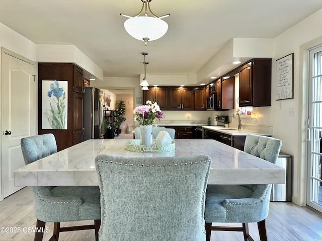 dining room with light wood finished floors