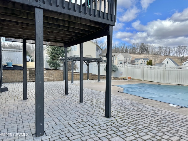 view of patio / terrace with a fenced in pool, fence, and a pergola