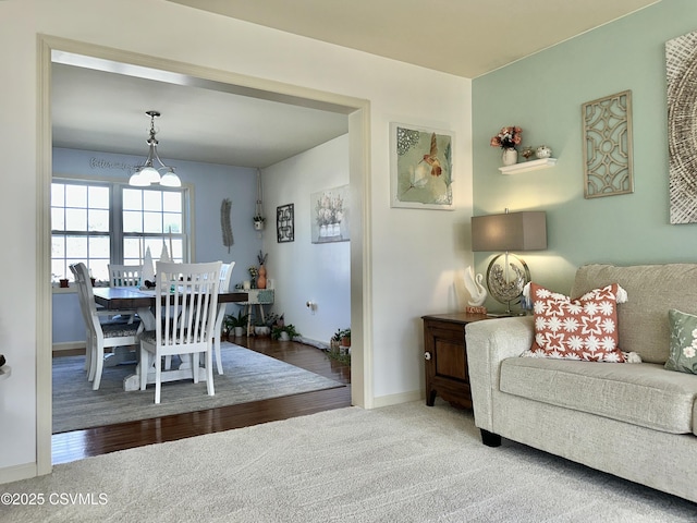 dining area featuring carpet floors and baseboards