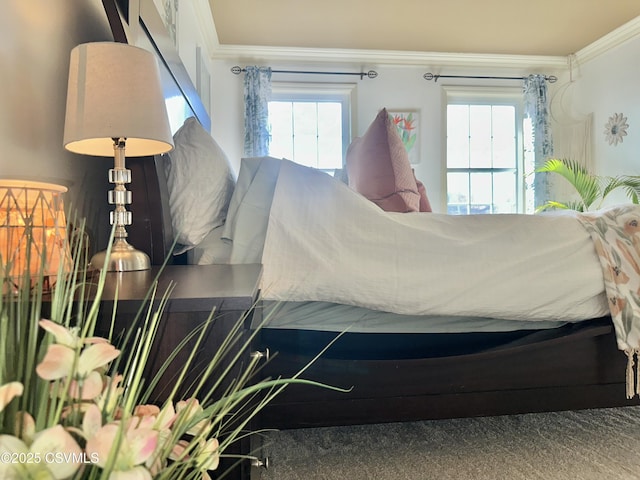 bedroom with ornamental molding