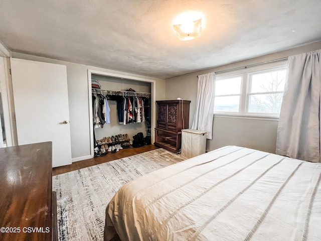 bedroom featuring a closet and wood finished floors