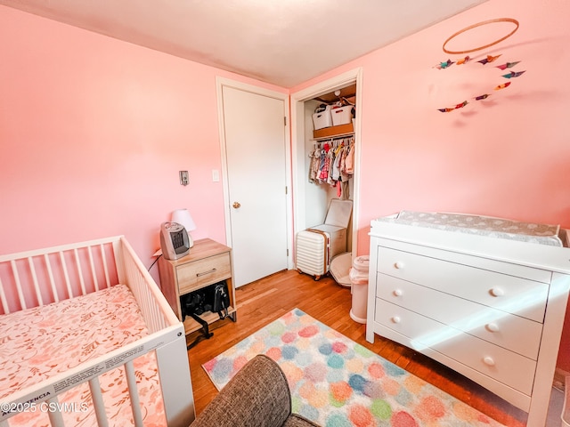 bedroom featuring a closet and wood finished floors