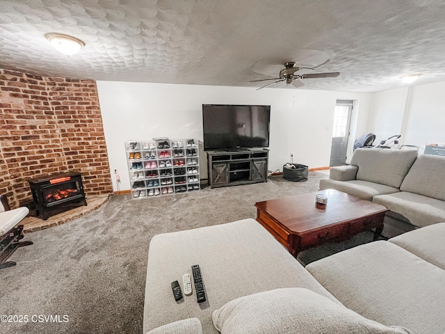 carpeted living area with a fireplace, baseboards, and a textured ceiling