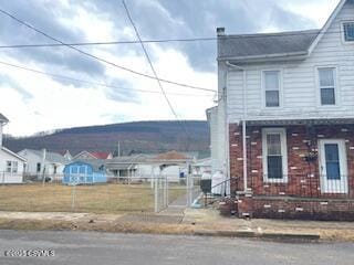 view of front of house featuring fence