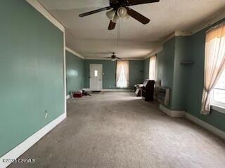 interior space featuring baseboards and crown molding