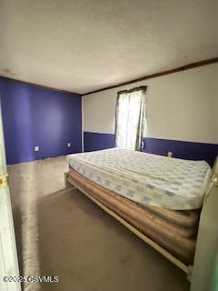 unfurnished bedroom featuring ornamental molding