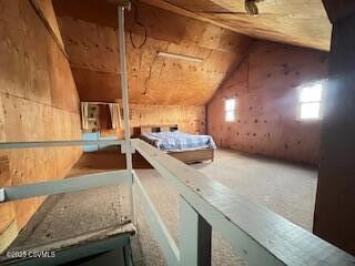 unfurnished bedroom with lofted ceiling