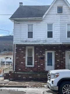 townhome / multi-family property featuring brick siding