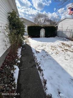 view of yard layered in snow