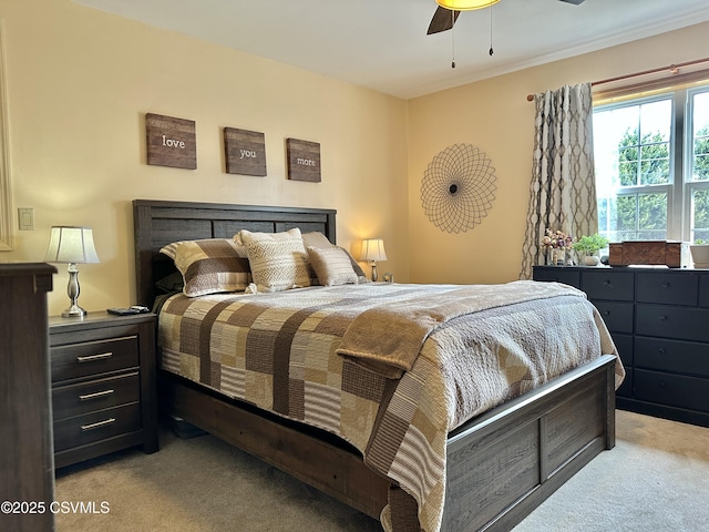 bedroom featuring ceiling fan and carpet flooring