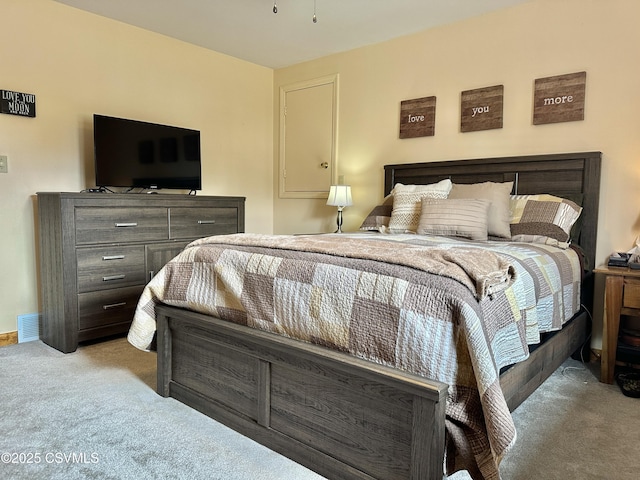 bedroom featuring carpet flooring, visible vents, and baseboards