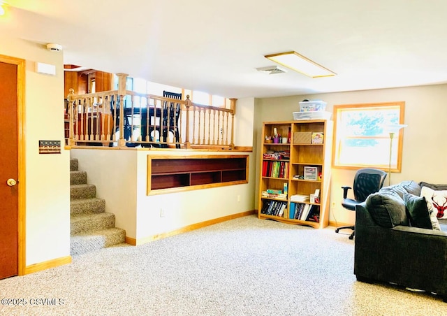 office space with carpet, visible vents, and baseboards