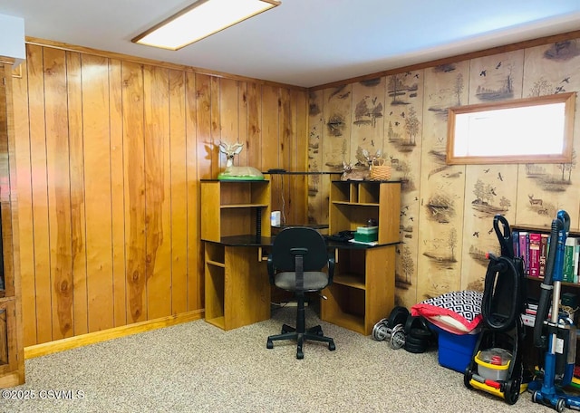 carpeted office space with wood walls