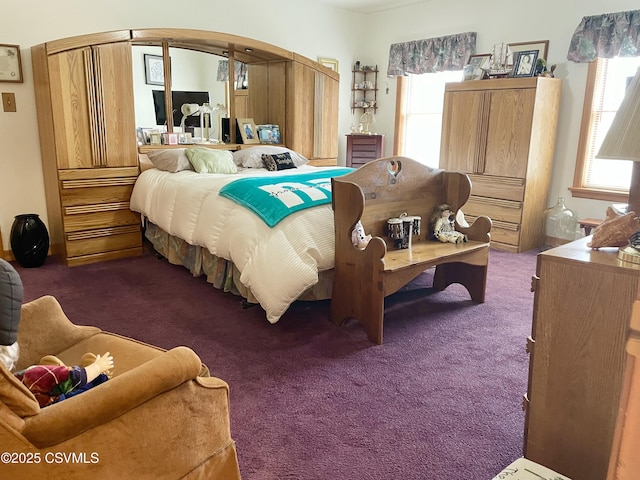 bedroom with dark carpet