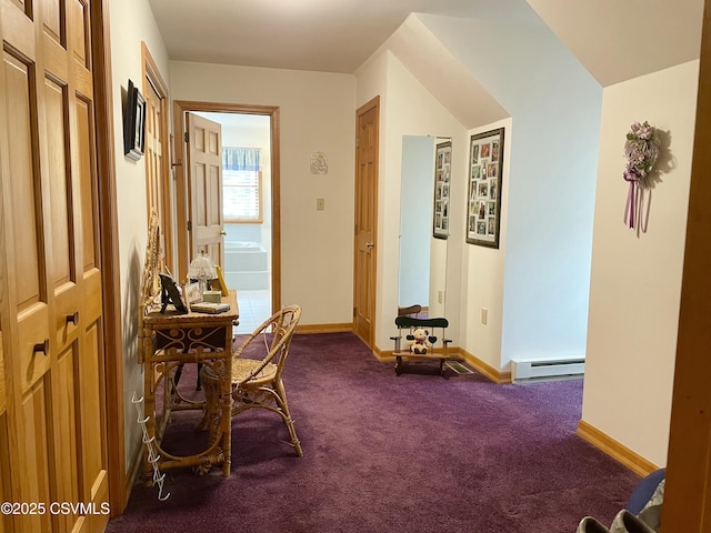 corridor featuring carpet floors, baseboards, and a baseboard heating unit