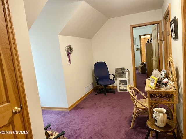 sitting room featuring carpet, visible vents, vaulted ceiling, and baseboards