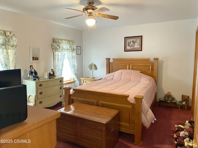 bedroom featuring dark carpet and ceiling fan