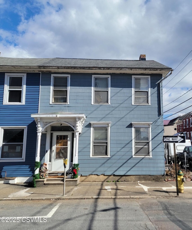 view of front of home with a chimney