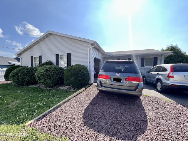 view of front facade featuring an attached garage and a front lawn