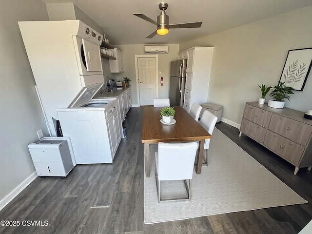 dining space with a ceiling fan, baseboards, and dark wood-type flooring