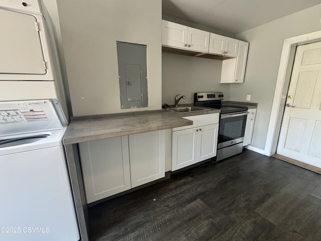 kitchen featuring stainless steel electric range oven, white cabinets, a sink, stacked washing maching and dryer, and electric panel