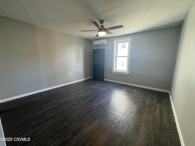 unfurnished bedroom with dark wood-style floors, a wall mounted air conditioner, a ceiling fan, and baseboards