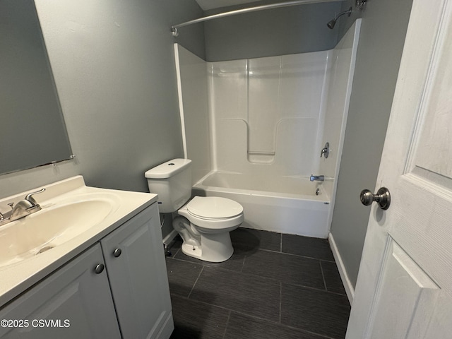 full bathroom with shower / bathtub combination, toilet, vanity, tile patterned flooring, and baseboards