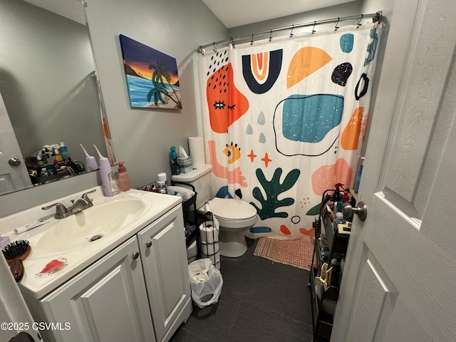 full bath with tile patterned flooring, a shower with shower curtain, vanity, and toilet